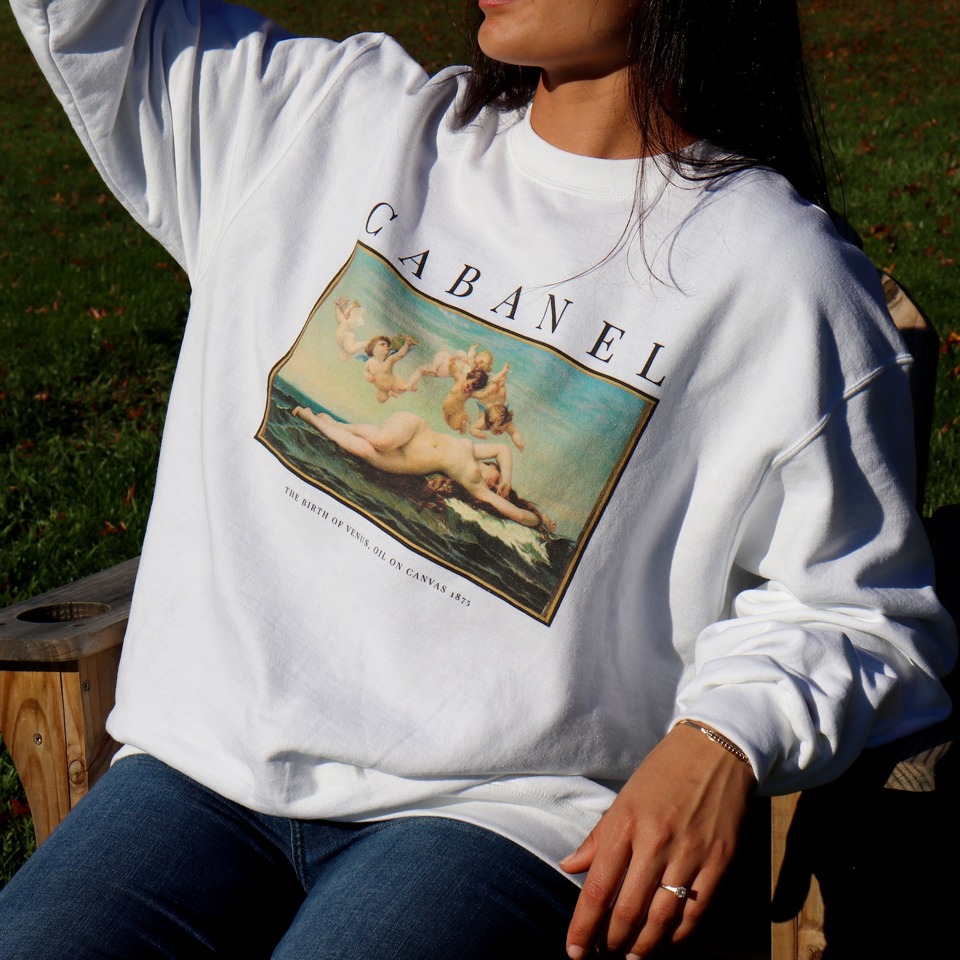woman wearing birth of venus sweatshirt by whitney baldwin home