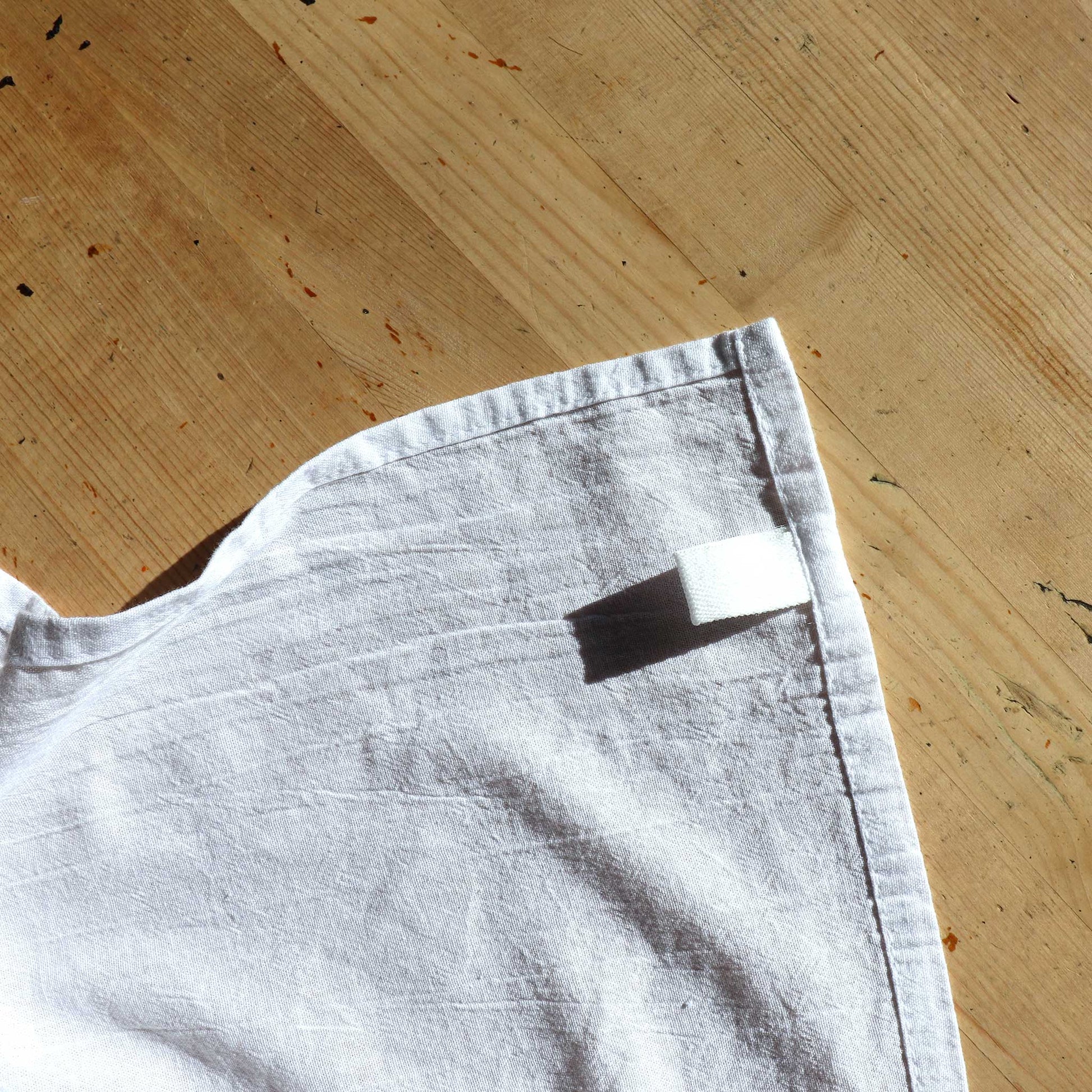 homestead harvest valley orchard apple orchard tea towel. The tea towel has a loop for ease of use and hanging abilities.