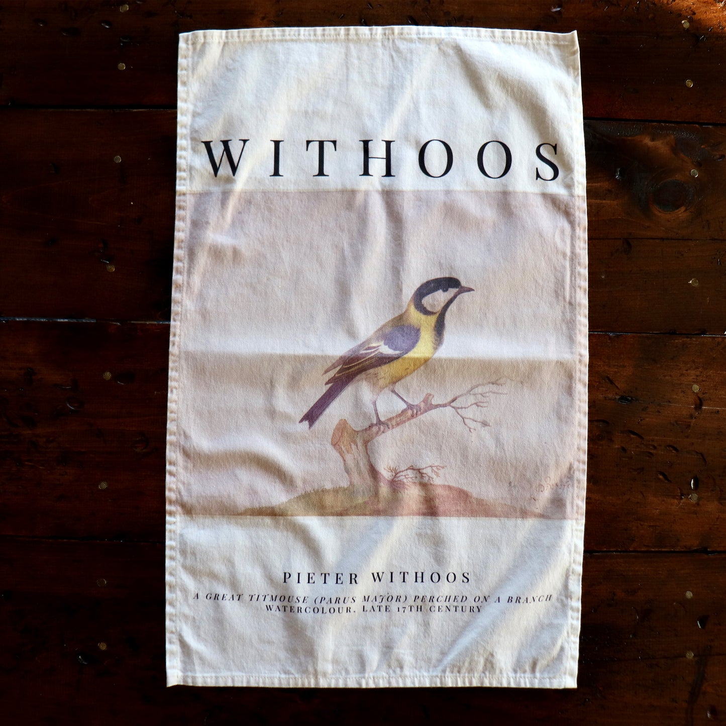 Close-up of a cotton kitchen towel showcasing Pieter Withoos’ detailed watercolor of a titmouse perched on a branch, soft and absorbent for everyday use