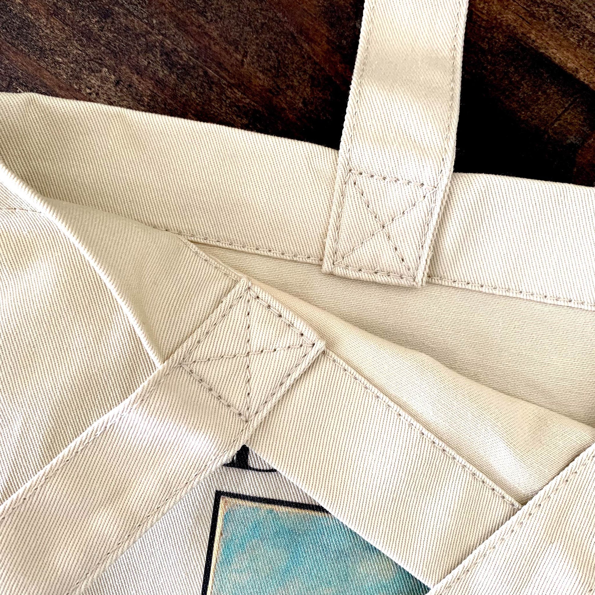 reinforced cross sticking straps. the market tote can carry up to 30 pounds.