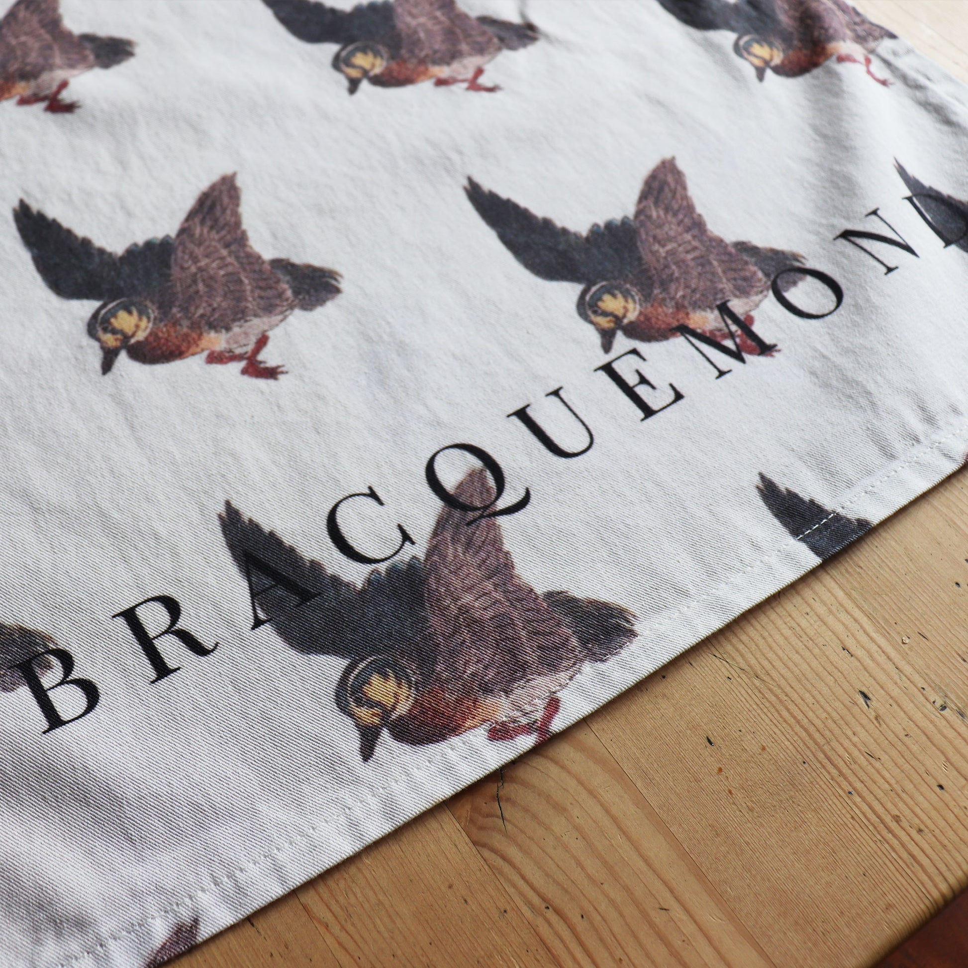 Bracquemond Duck Print Kitchen Towel. Repreating duck print on a soft kitchen towel. Close up image of the duck image